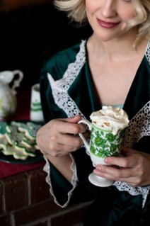 an Irish coffee in a white and green cup
